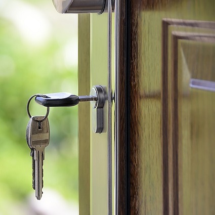 house key inserted into keyhole